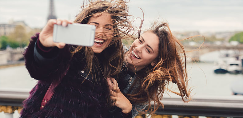 two friends taking a selfie together